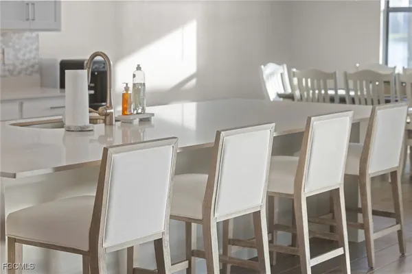 a dining room with furniture and window