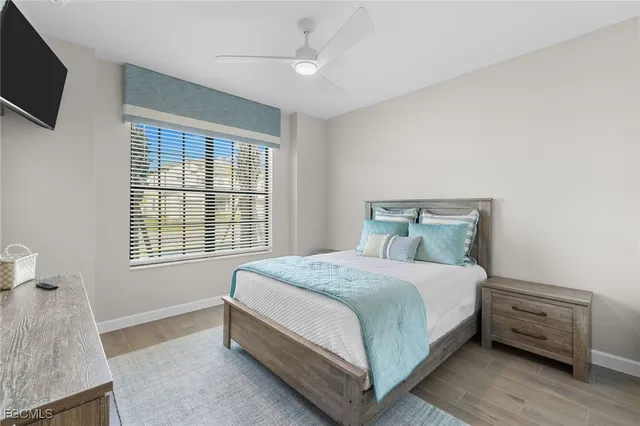 a bedroom with a bed and a tv