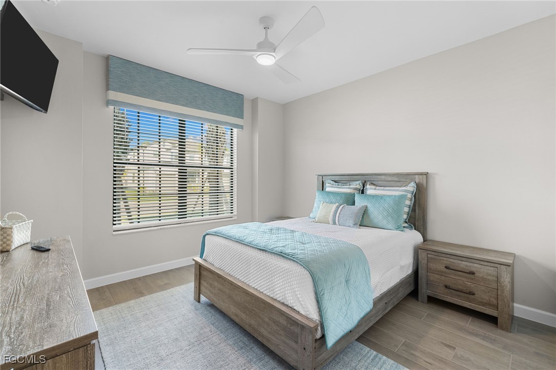 10575 Timber Creek Drive Fort Myers, FL 33913 - Photo 25 of 50 a bedroom with a bed and a tv