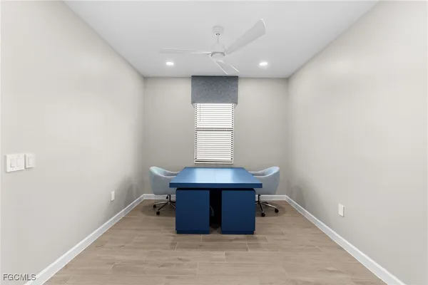 a room with wooden floor and window