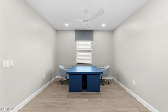 a room with wooden floor and window