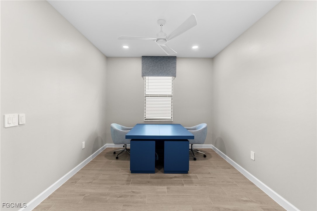 10575 Timber Creek Drive Fort Myers, FL 33913 - Photo 27 of 50 a room with wooden floor and window