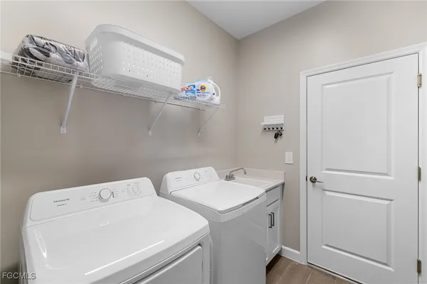a utility room with dryer and washer