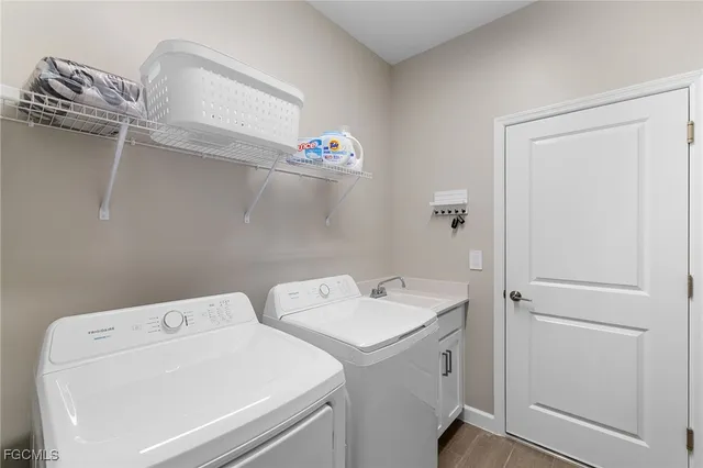 a utility room with dryer and washer