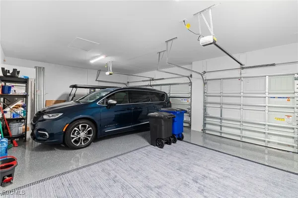 a view of a garage and car parked