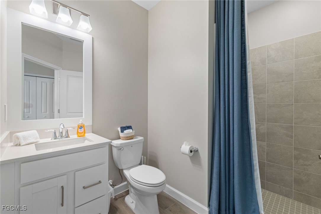 10575 Timber Creek Drive Fort Myers, FL 33913 - Photo 31 of 50 a bathroom with a sink toilet and a mirror