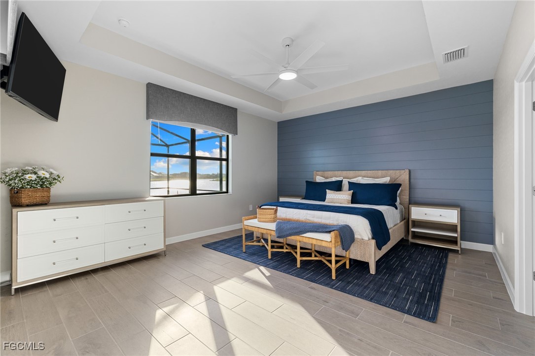 10575 Timber Creek Drive Fort Myers, FL 33913 - Photo 32 of 50 a bedroom with a bed and a window