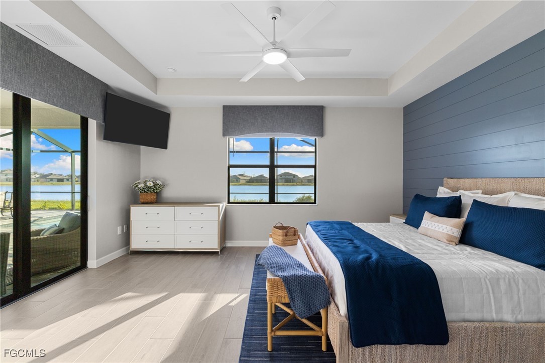 10575 Timber Creek Drive Fort Myers, FL 33913 - Photo 33 of 50 a bedroom with a large bed and a window