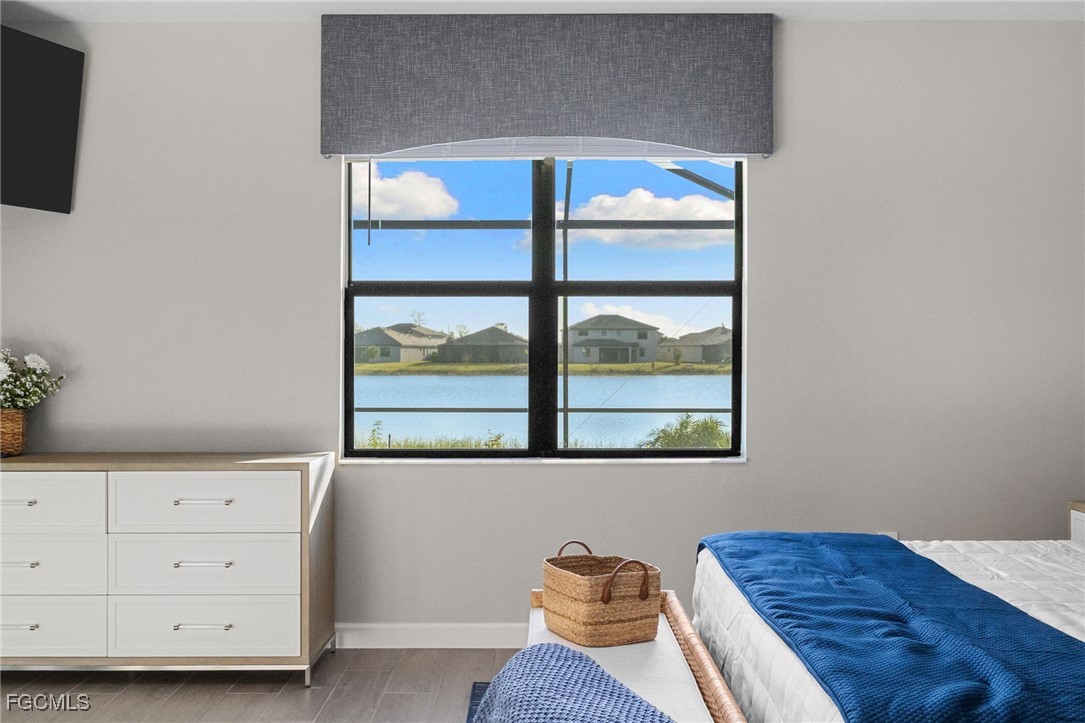 10575 Timber Creek Drive Fort Myers, FL 33913 - Photo 34 of 50 a view of a bedroom with furniture and window
