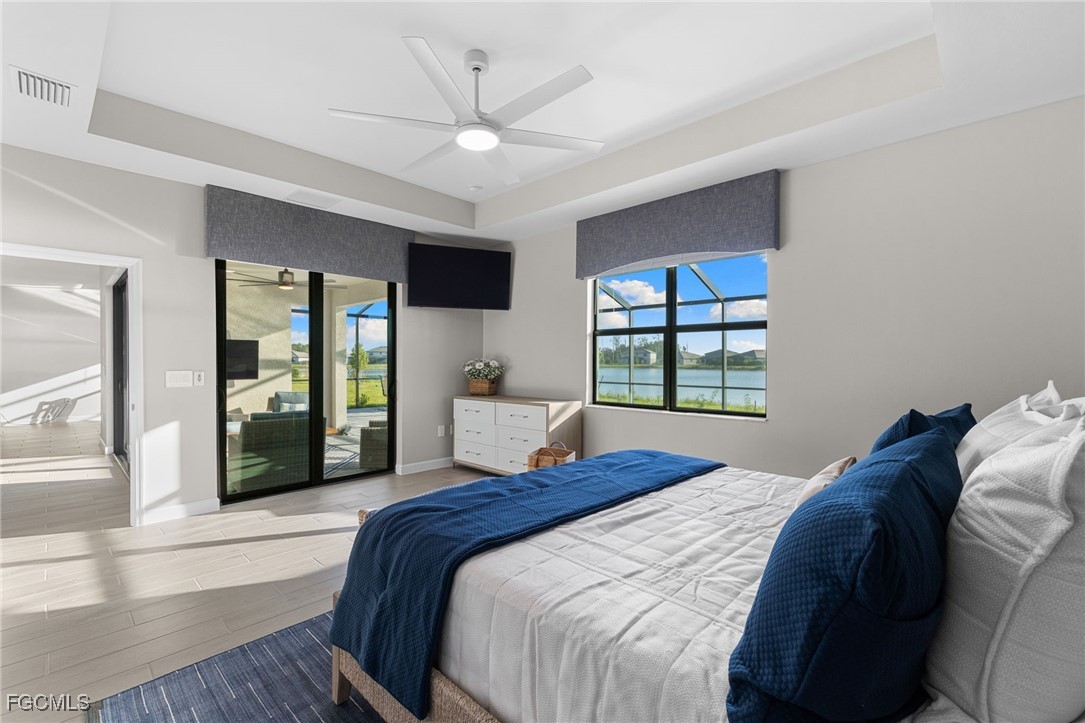 10575 Timber Creek Drive Fort Myers, FL 33913 - Photo 35 of 50 a bedroom with a large bed and a window