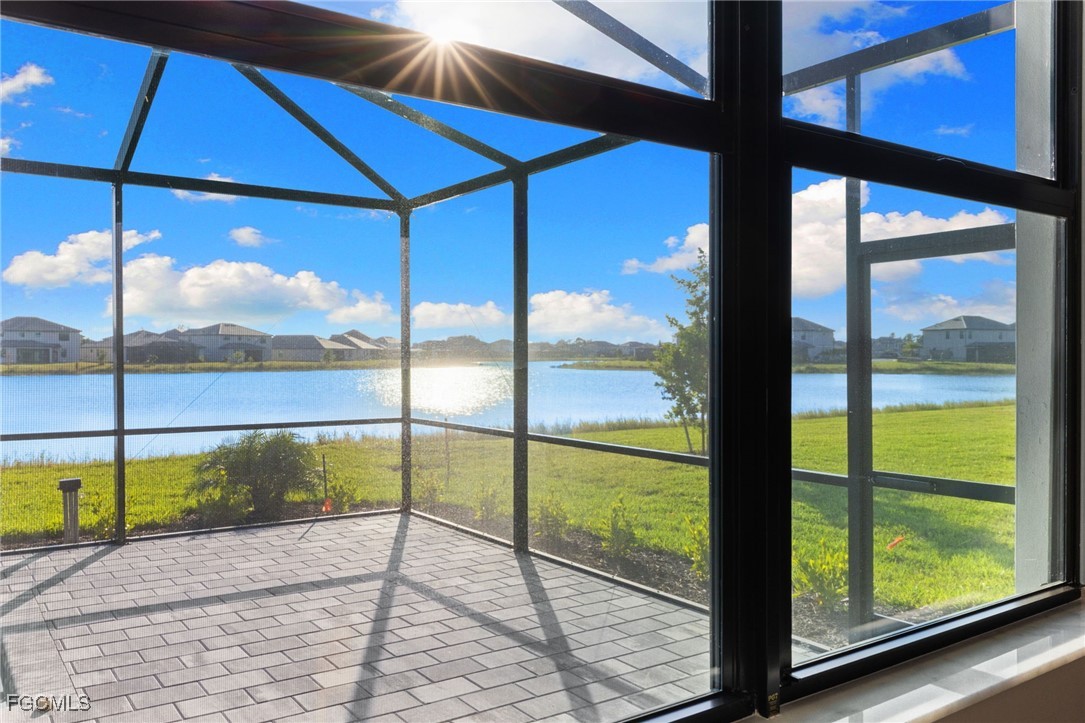 10575 Timber Creek Drive Fort Myers, FL 33913 - Photo 36 of 50 a view of a glass door with a yard from a window