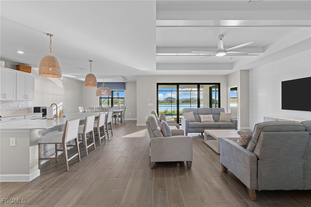 10575 Timber Creek Drive Fort Myers, FL 33913 - Photo 4 of 50 a living room with furniture and a wooden floor