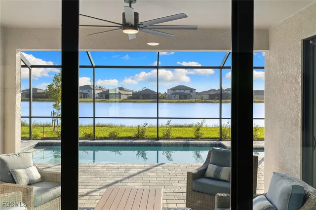 a view of a living room with a floor to ceiling window in a patio