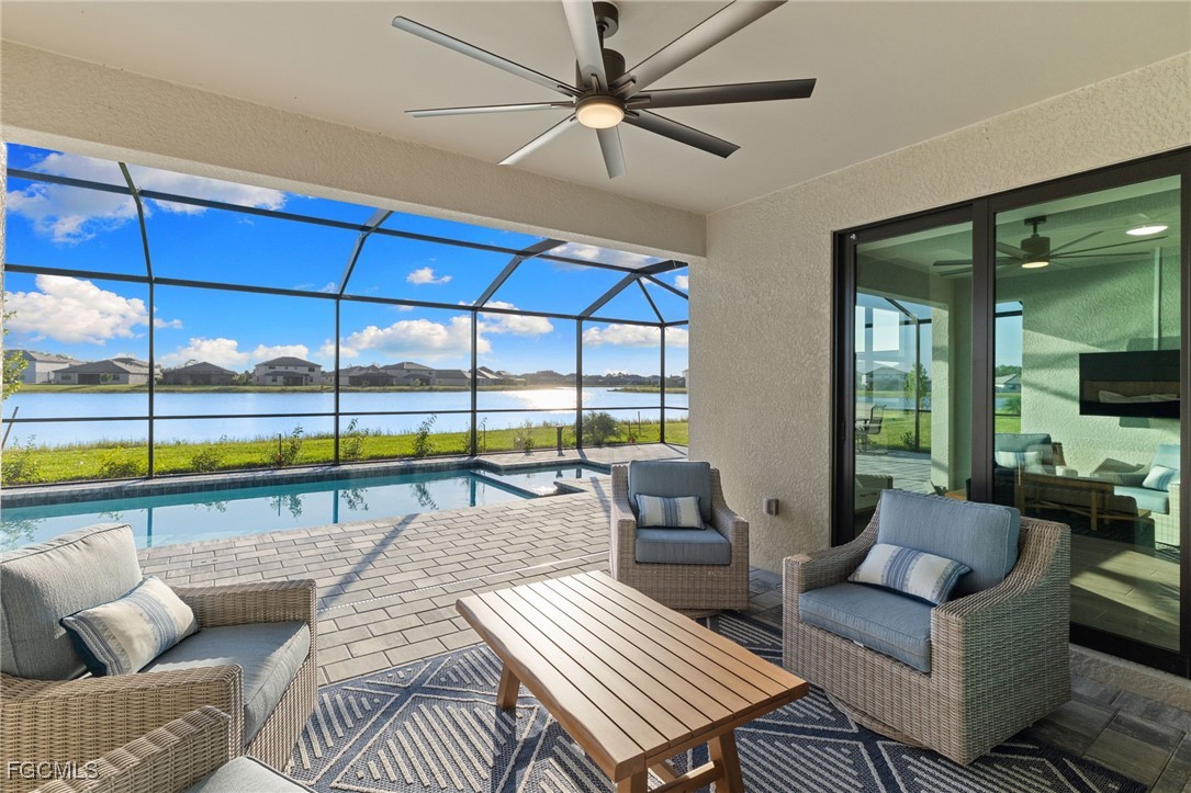10575 Timber Creek Drive Fort Myers, FL 33913 - Photo 44 of 50 a living room with furniture and a floor to ceiling window