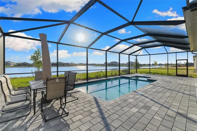 a view of a swimming pool with a patio