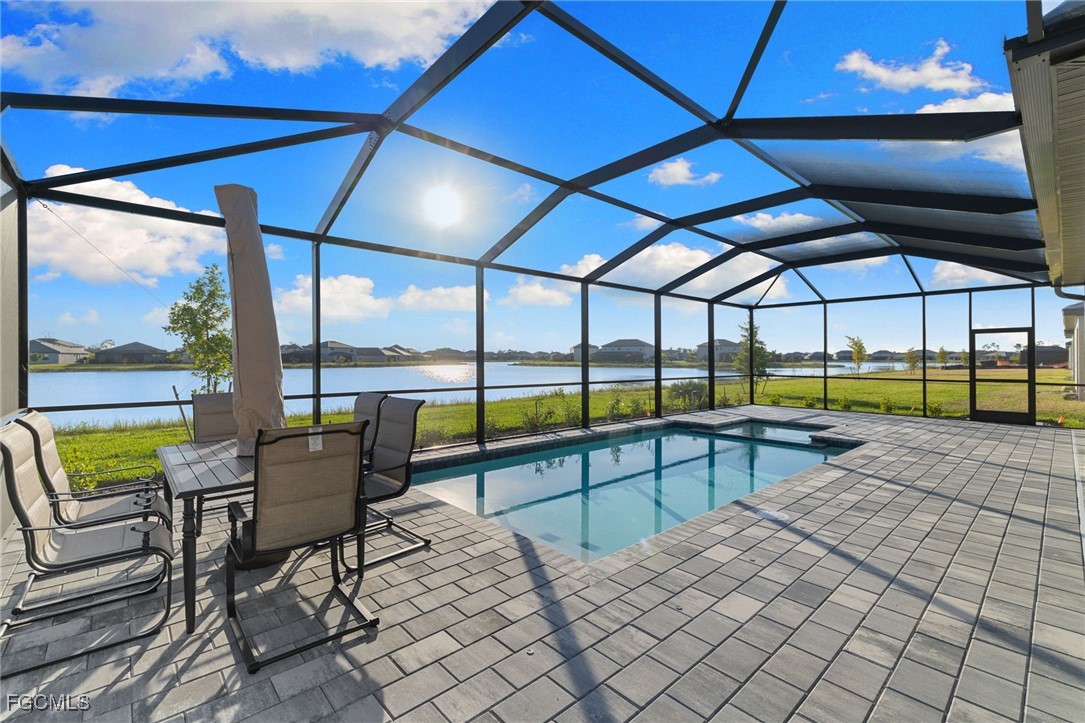 10575 Timber Creek Drive Fort Myers, FL 33913 - Photo 46 of 50 a view of a swimming pool with a patio