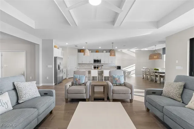 a living room with furniture white walls and a fireplace