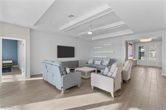 a living room with couches and a flat screen tv