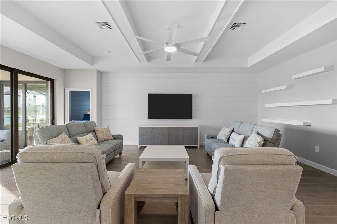 10575 Timber Creek Drive Fort Myers, FL 33913 - Photo 9 of 50 a living room with furniture and a flat screen tv