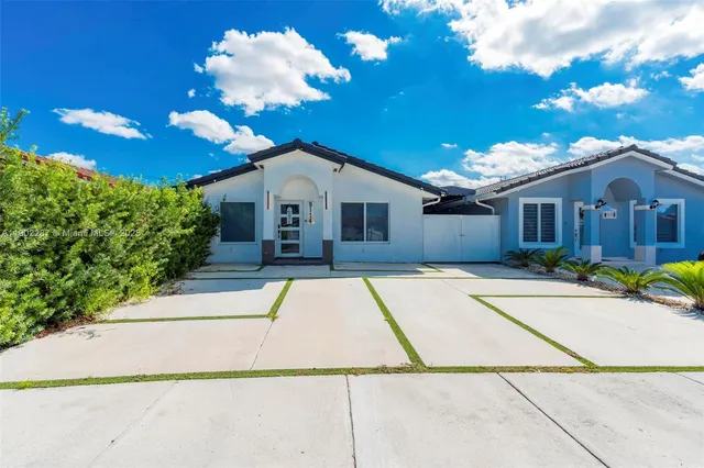 a view of a white building with a entertaining space