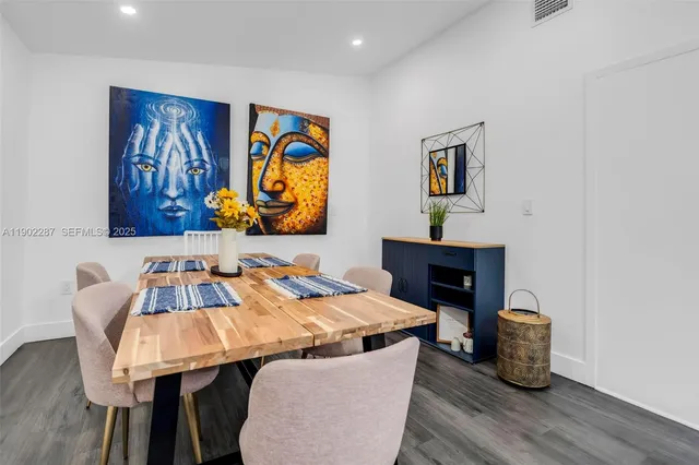 a white toilet sitting next to a white sink