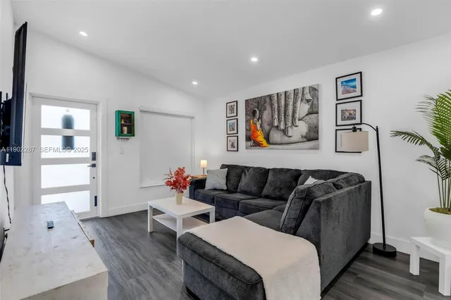 a view of a dining room with furniture wooden floor and window