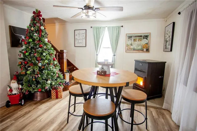 a view of a dining room with furniture and wooden floor