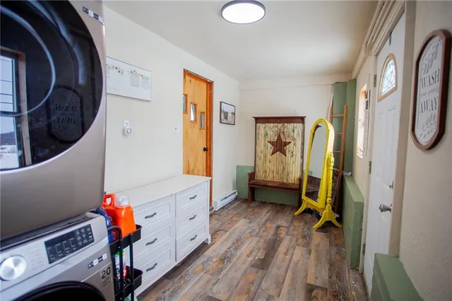 a view of an entryway with wooden floor