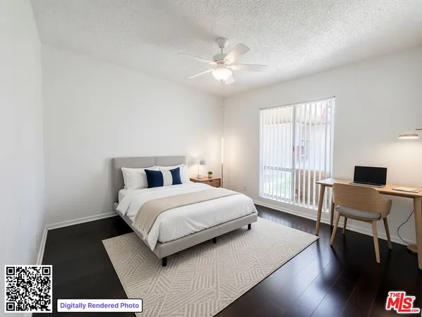 a bedroom with a large bed a chandelier and a window