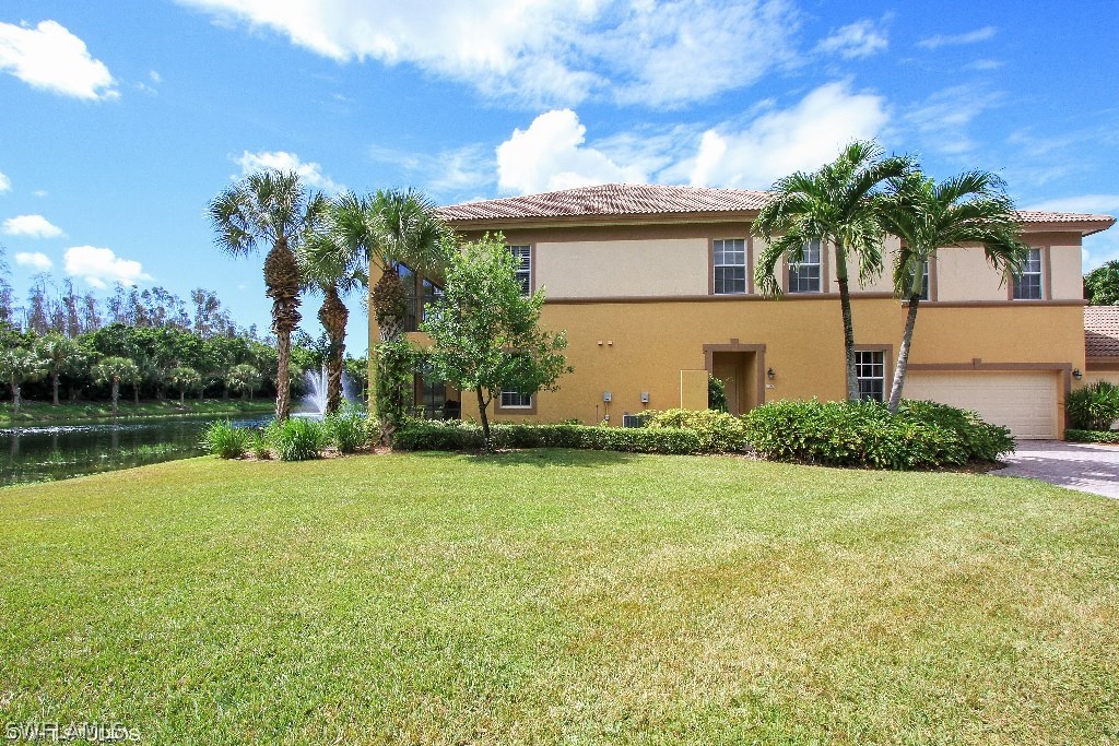 10110 Valiant Court, Unit 101 Fort Myers, FL 33913 - Photo 12 of 25 a front view of a house with garden