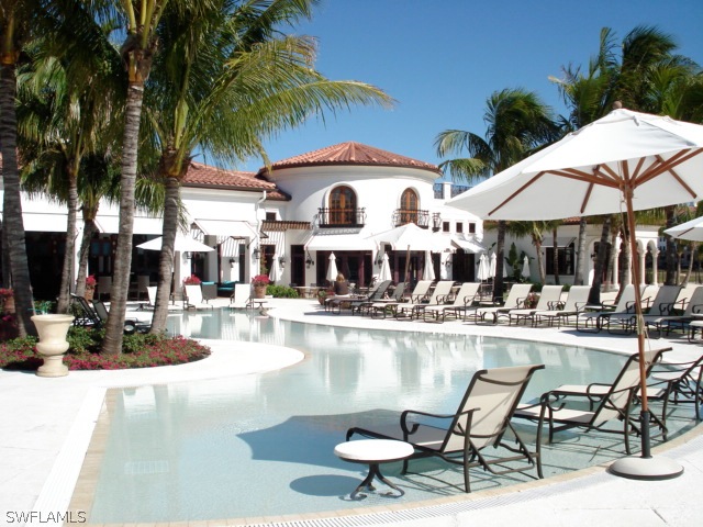 10110 Valiant Court, Unit 101 Fort Myers, FL 33913 - Photo 20 of 25 a view of a swimming pool with chairs