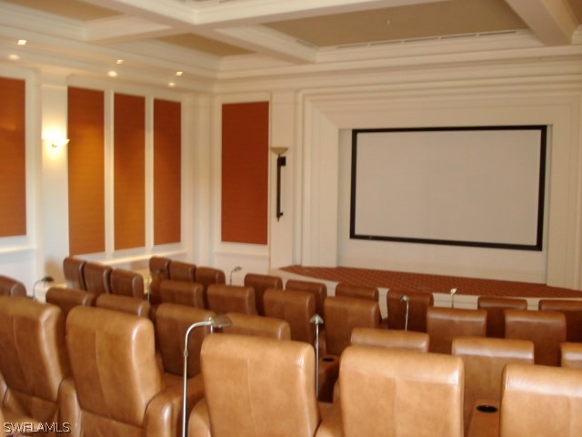 10110 Valiant Court, Unit 101 Fort Myers, FL 33913 - Photo 23 of 25 a media room with lots of chairs and a projector