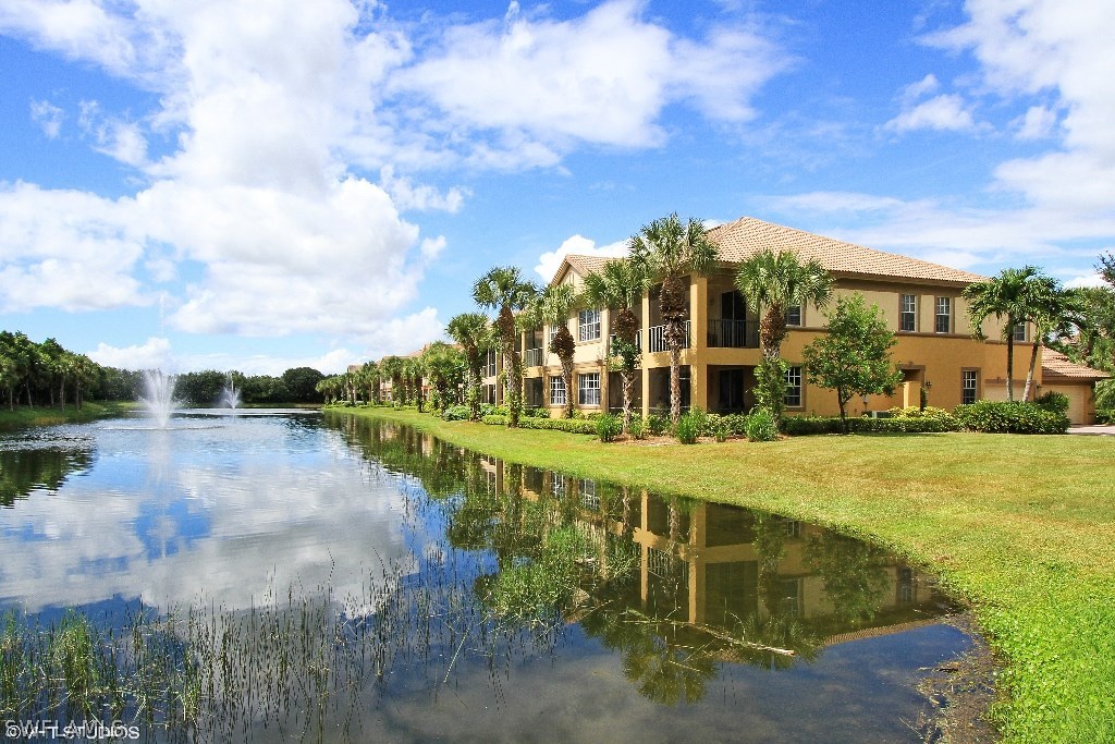 10110 Valiant Court, Unit 101 Fort Myers, FL 33913 - Photo 3 of 25 a view of a lake with a building in front of it