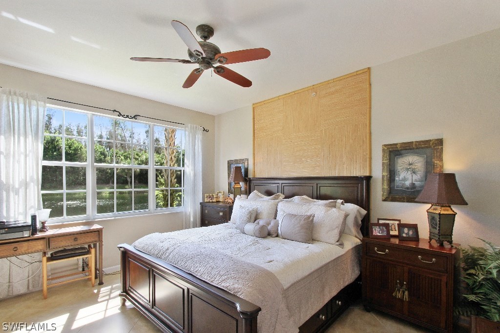 10110 Valiant Court, Unit 101 Fort Myers, FL 33913 - Photo 6 of 25 a bed room with a bed and a window