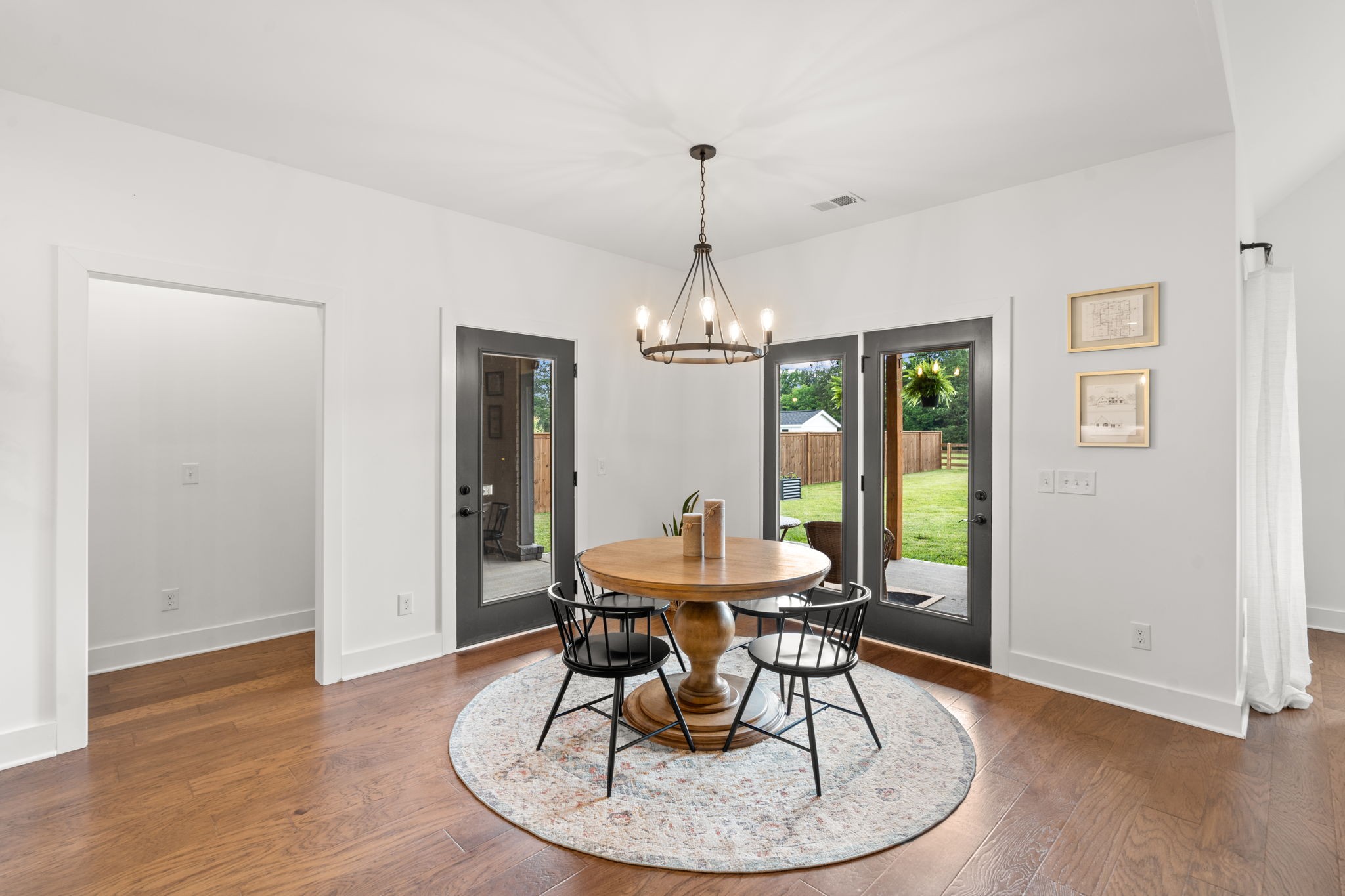 6560 Murfreesboro Road Lebanon, TN 37090 - Photo 14 of 43 a dining room with furniture a chandelier and wooden floor