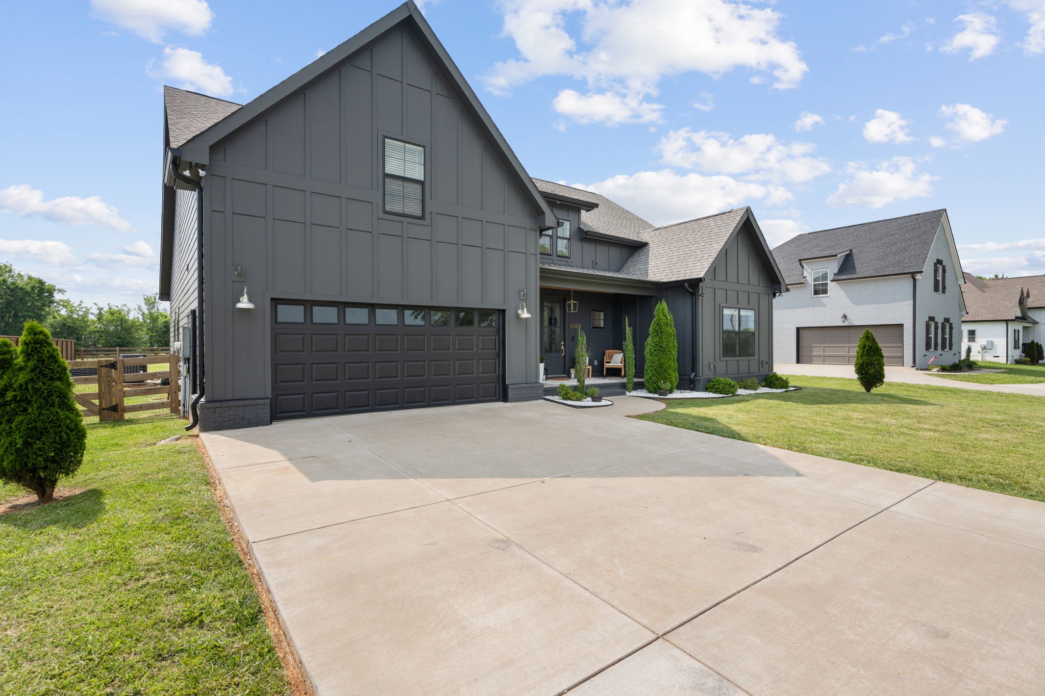 6560 Murfreesboro Road Lebanon, TN 37090 - Photo 2 of 43 a front view of a house with a yard and garage