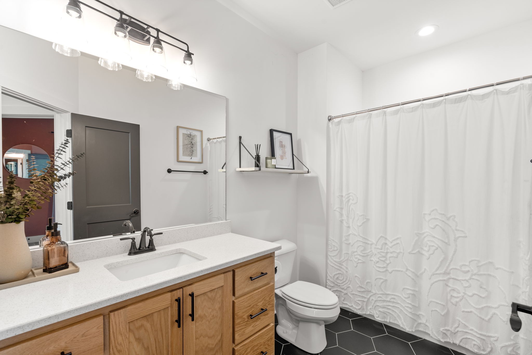 6560 Murfreesboro Road Lebanon, TN 37090 - Photo 27 of 43 a bathroom with a granite countertop sink toilet and mirror