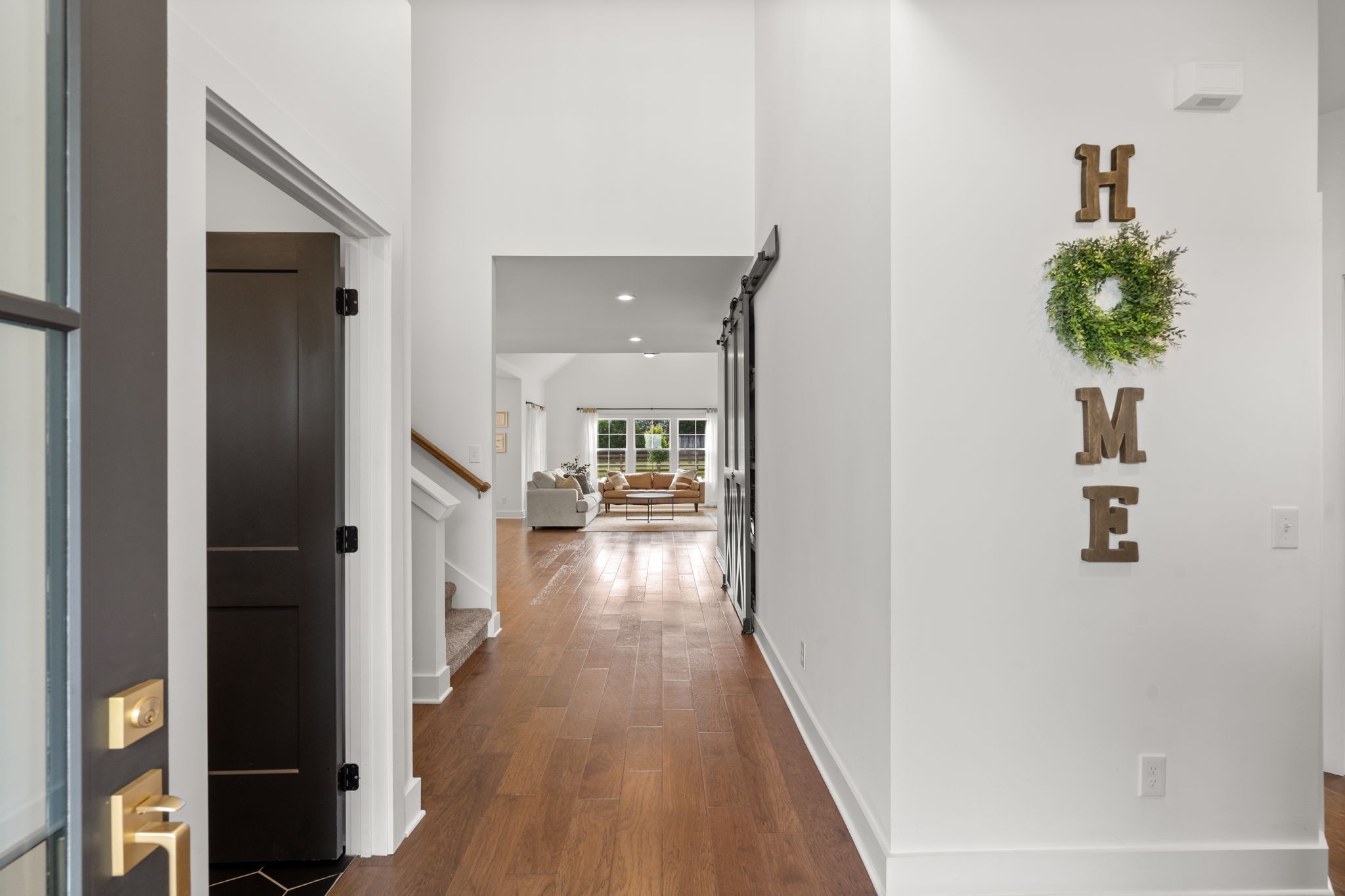 6560 Murfreesboro Road Lebanon, TN 37090 - Photo 7 of 43 a view of a hallway with wooden floor and staircase