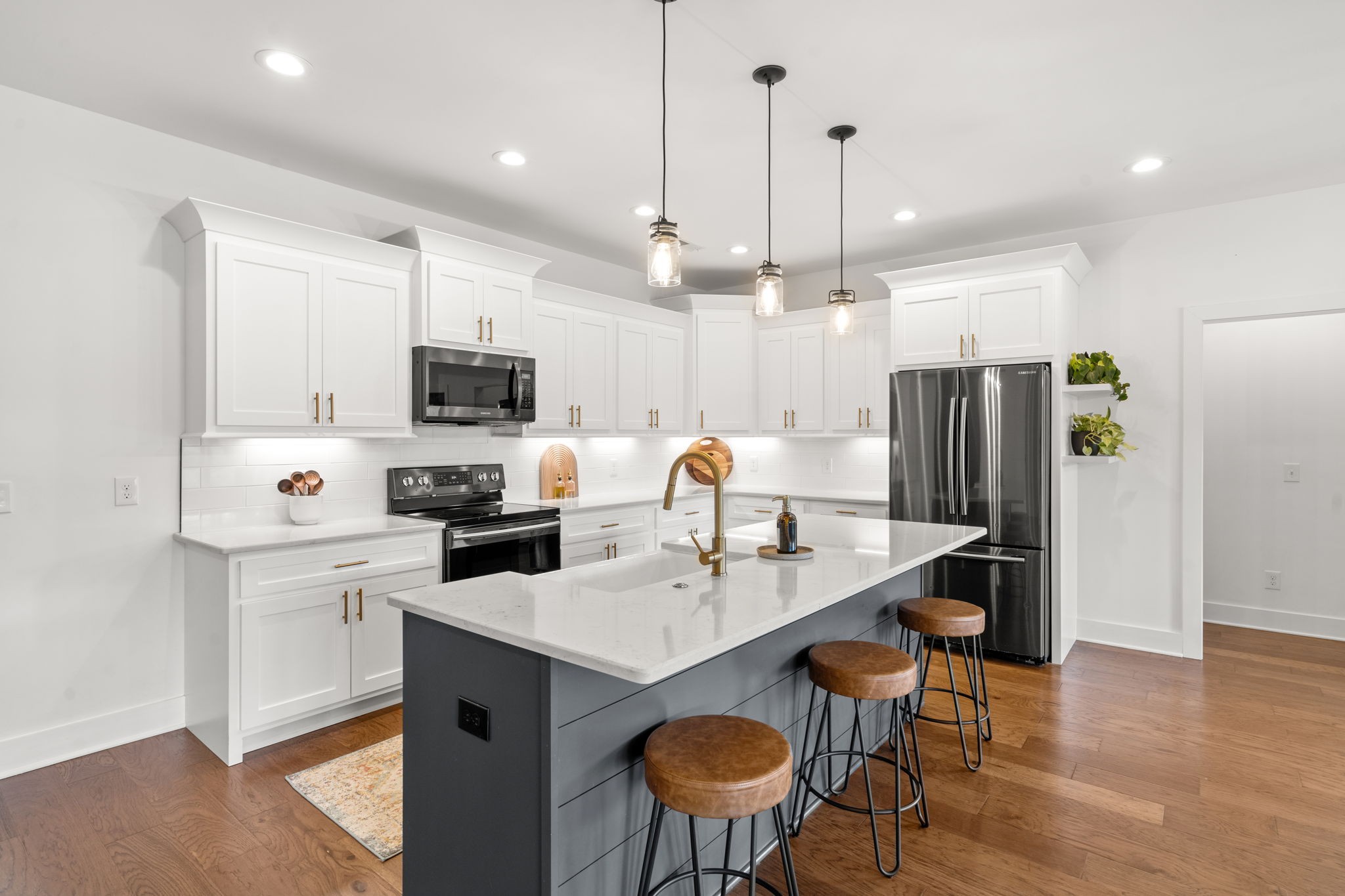 6560 Murfreesboro Road Lebanon, TN 37090 - Photo 10 of 43 a kitchen with a sink a kitchen island and chairs