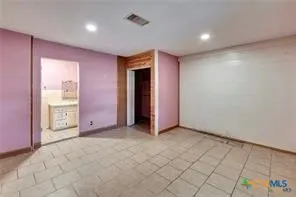 an empty room with mirror