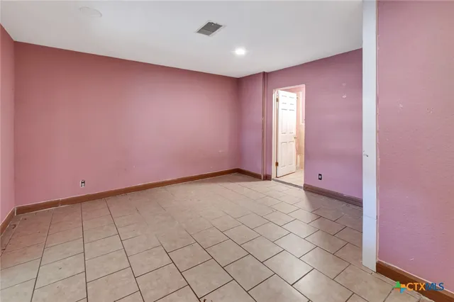 a view of an empty room and window