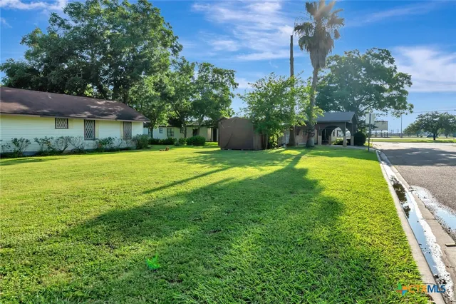 a view of a backyard with a garden
