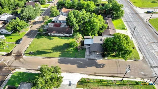 a view of backyard with swimming pool