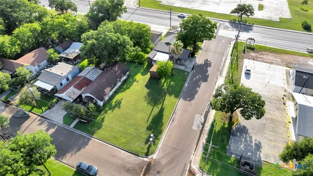 an aerial view of a house with a garden
