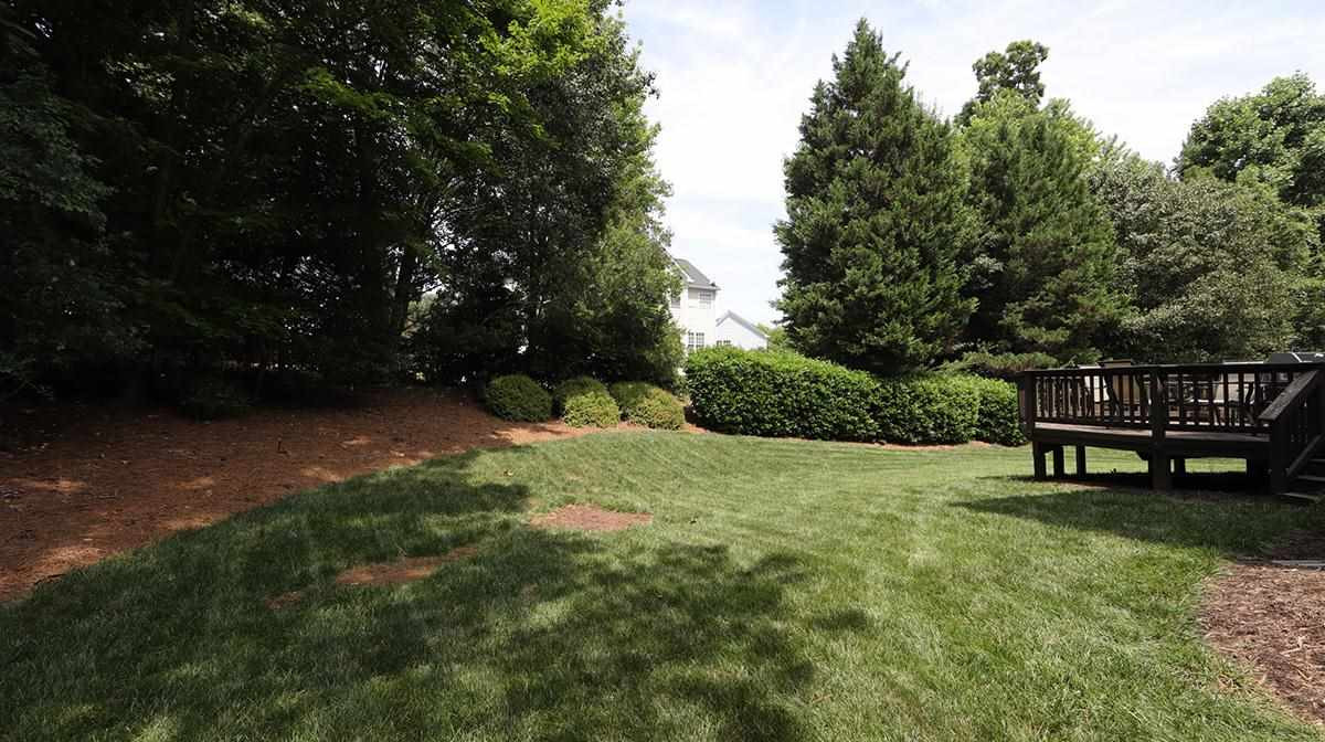 10705 Chesson Drive Raleigh, NC 27614 - Photo 30 of 30 Mature landscaping provides privacy for the backyard. Backyard