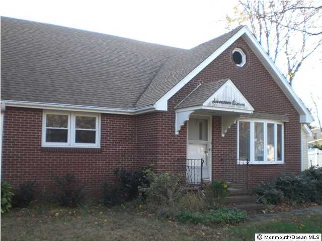 1711 Marconi Road Wall, NJ 07719 - Photo 3 of 3 a front view of a house with garden