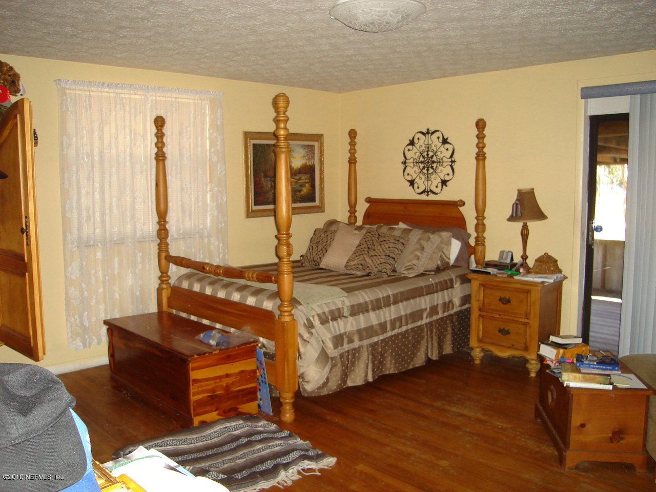 2586 Broward Road Jacksonville, FL 32218 - Photo 6 of 10 a bedroom with furniture and wooden floor