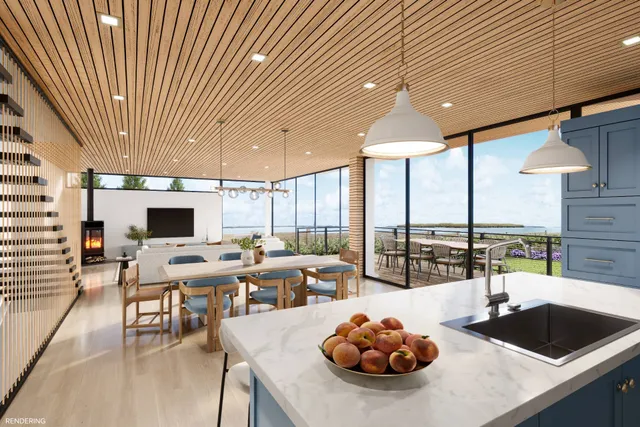 a large kitchen with a table and chairs