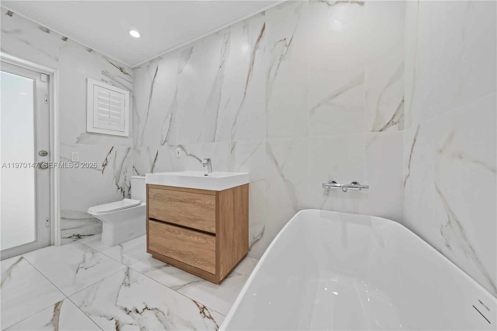 8801 Southwest 124th Street Miami, FL 33176 - Photo 18 of 48 a bathroom with a sink a toilet and shower