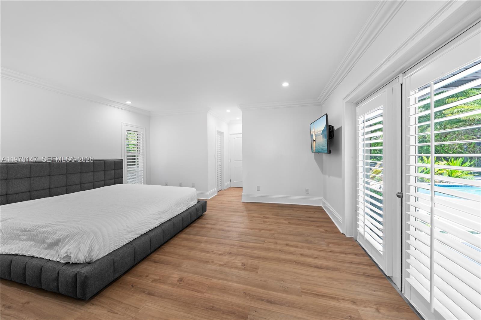 8801 Southwest 124th Street Miami, FL 33176 - Photo 20 of 48 a spacious bedroom with a bed and a window